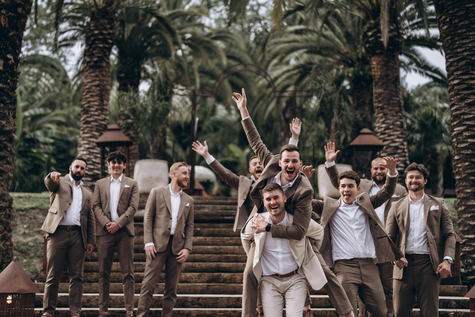 Golden-hour view of the Portuguese coastline framing a relaxed outdoor wedding celebration