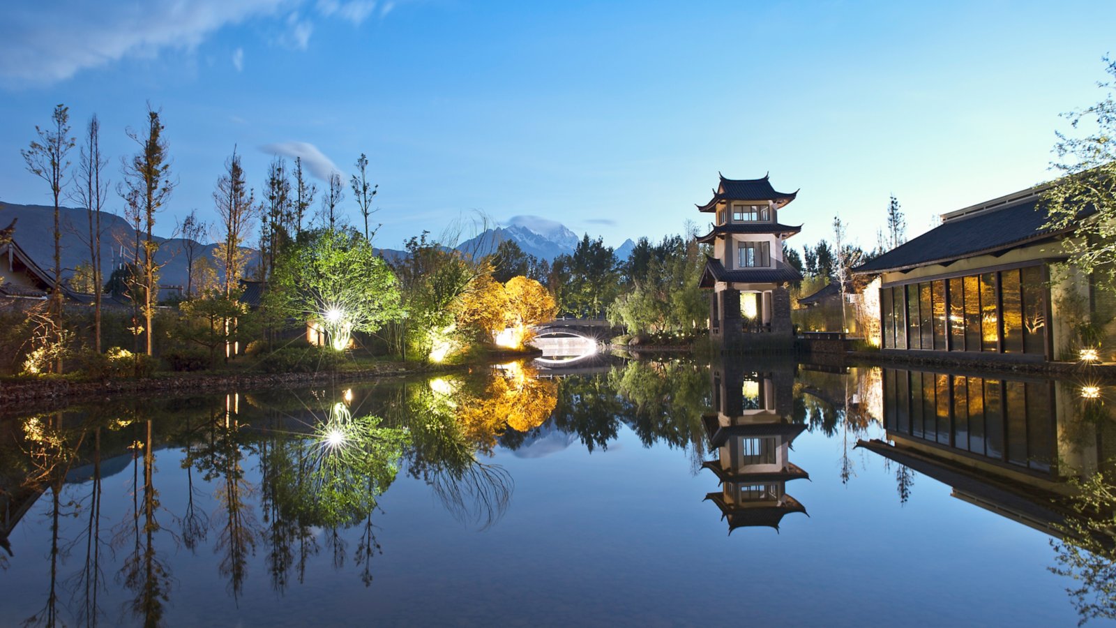 Pullman Lijiang Resort & Spa grounds beneath Jade Dragon Snow Mountain